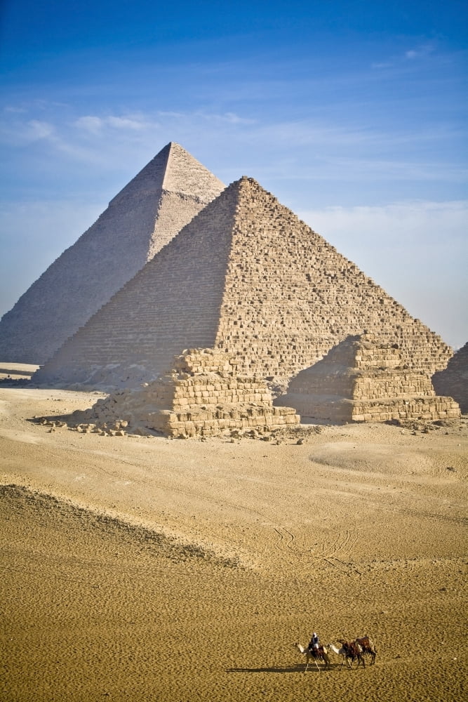 The Pyramids With Two Men On Camels Going By CairoEgyptAfrica Canvas Art - David DuChemin Design Pics (24 x 38)