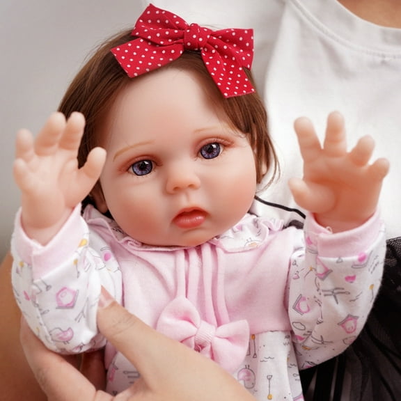 The Reborn Doll Is So Lifelike - A Reborn Baby Girl With Handcrafted Details, Including A Pink Dress, Big, Twinkling Eyes And Pink Lips