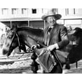 thumbnail image 1 of The Shootist 1976 John Wayne holds rifle & pillow by horse 8x10 inch photo, 1 of 1
