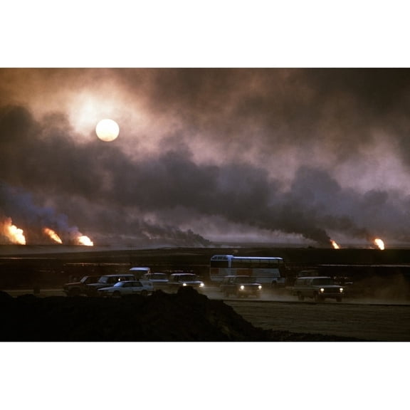 The Smoke From Oil Well Fires Forces Kuwait Drivers To Use Their Headlights During Daylight. Retreating Iraqi Troops Set