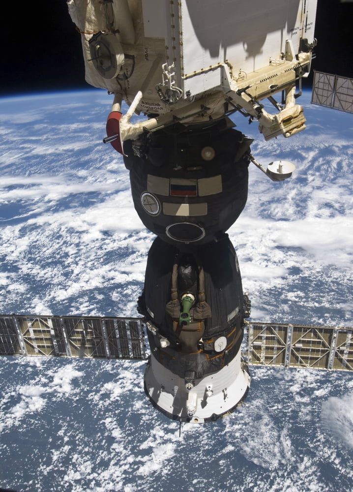 The Soyuz TMA-19 spacecraft docked to the Rassvet Mini-Research Module 1 Canvas Art - Stocktrek Images (24 x 34)