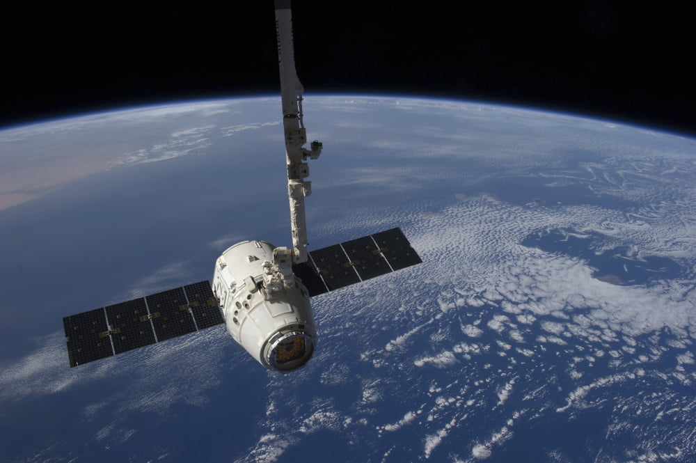 The SpaceX Dragon cargo craft prior to being released by the Canadarm2 robotic arm Canvas Art - Stocktrek Images (34 x 23)
