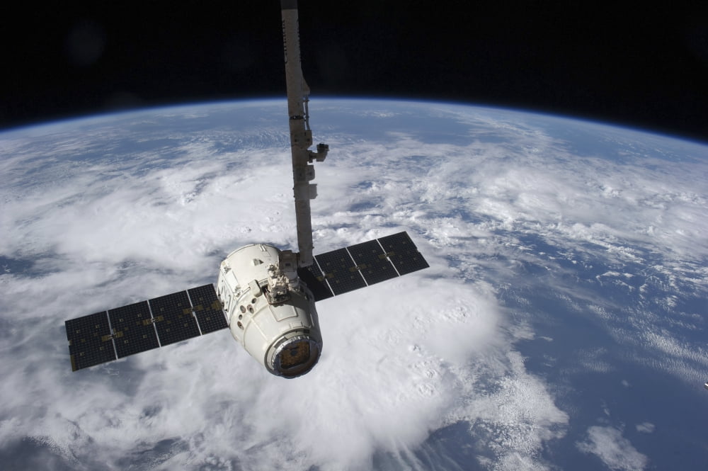 The SpaceX Dragon cargo craft prior to being released by the Canadarm2 robotic arm Canvas Art - Stocktrek Images (34 x 23)