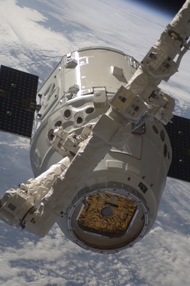 The SpaceX Dragon commercial cargo craft during grappling operations with Canadarm2 Canvas Art - Stocktrek Images (23 x 35)