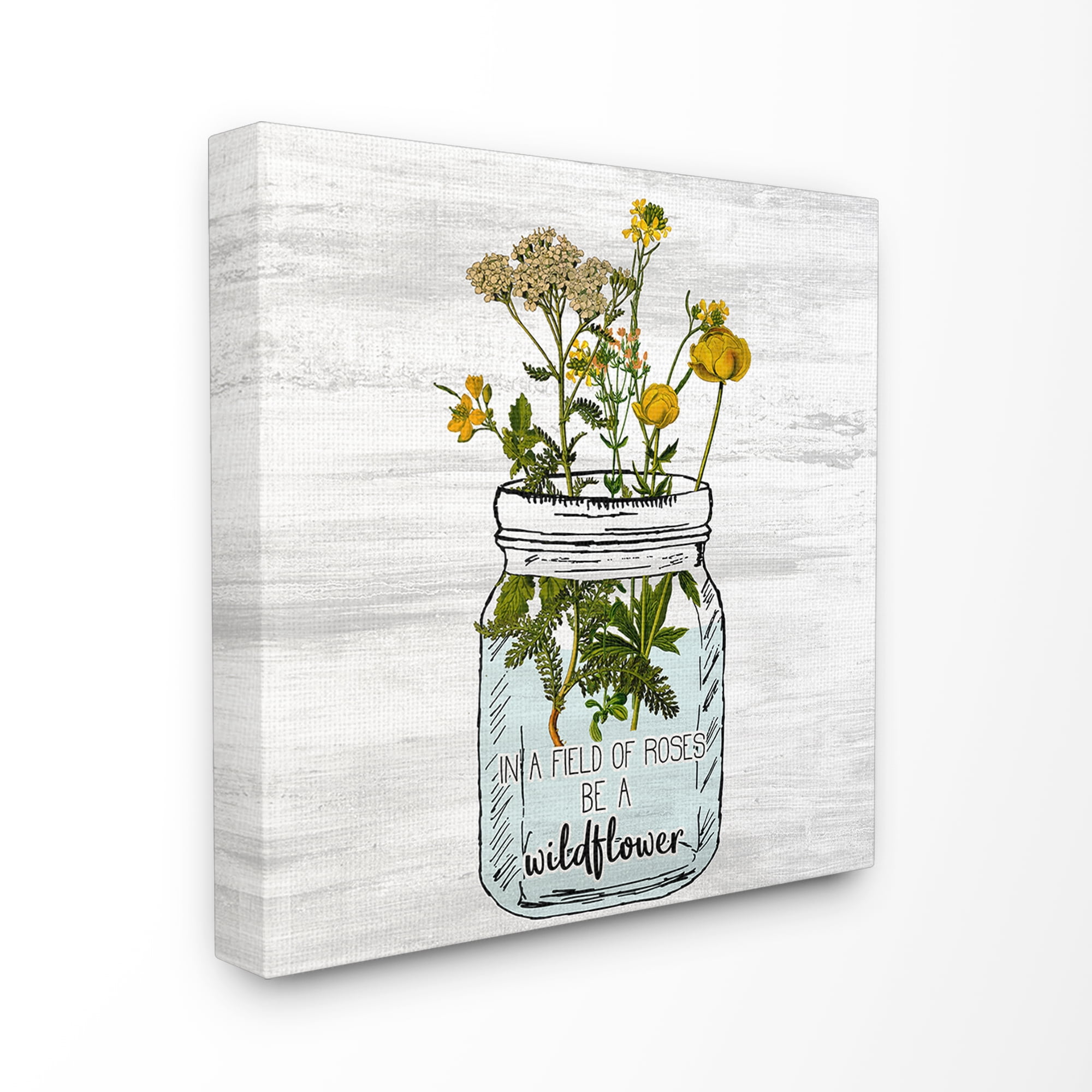 The Stupell Home Decor Be A Wildflower Yellow Flowers in a Mason Jar Canvas Wall Art
