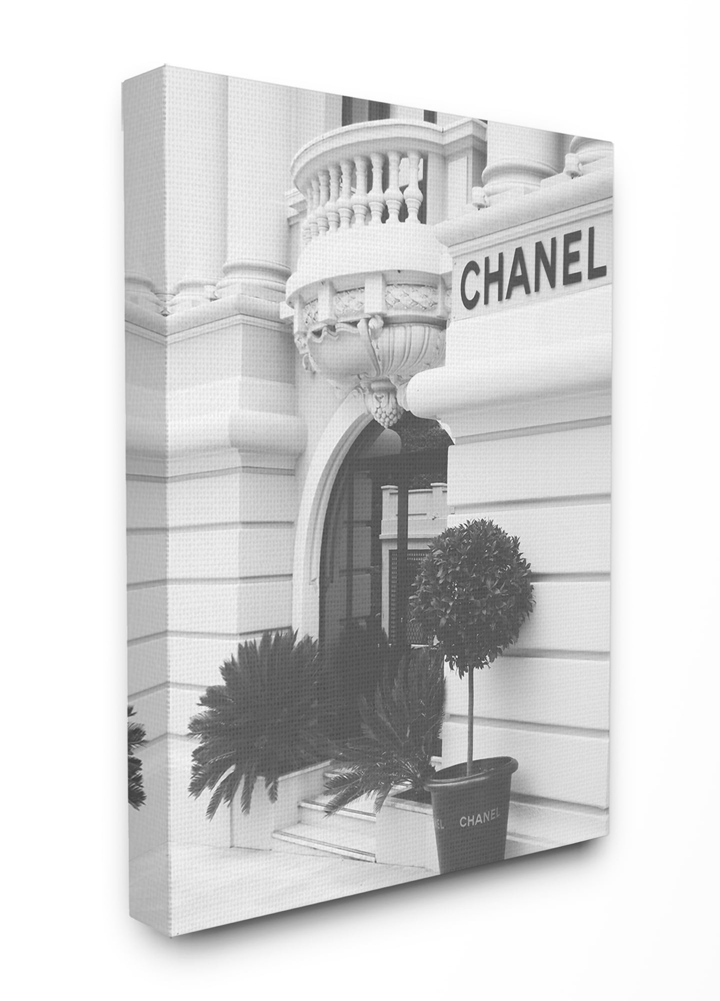 The Stupell Home Decor Black and White High Fashion Store Front Canvas Wall Art