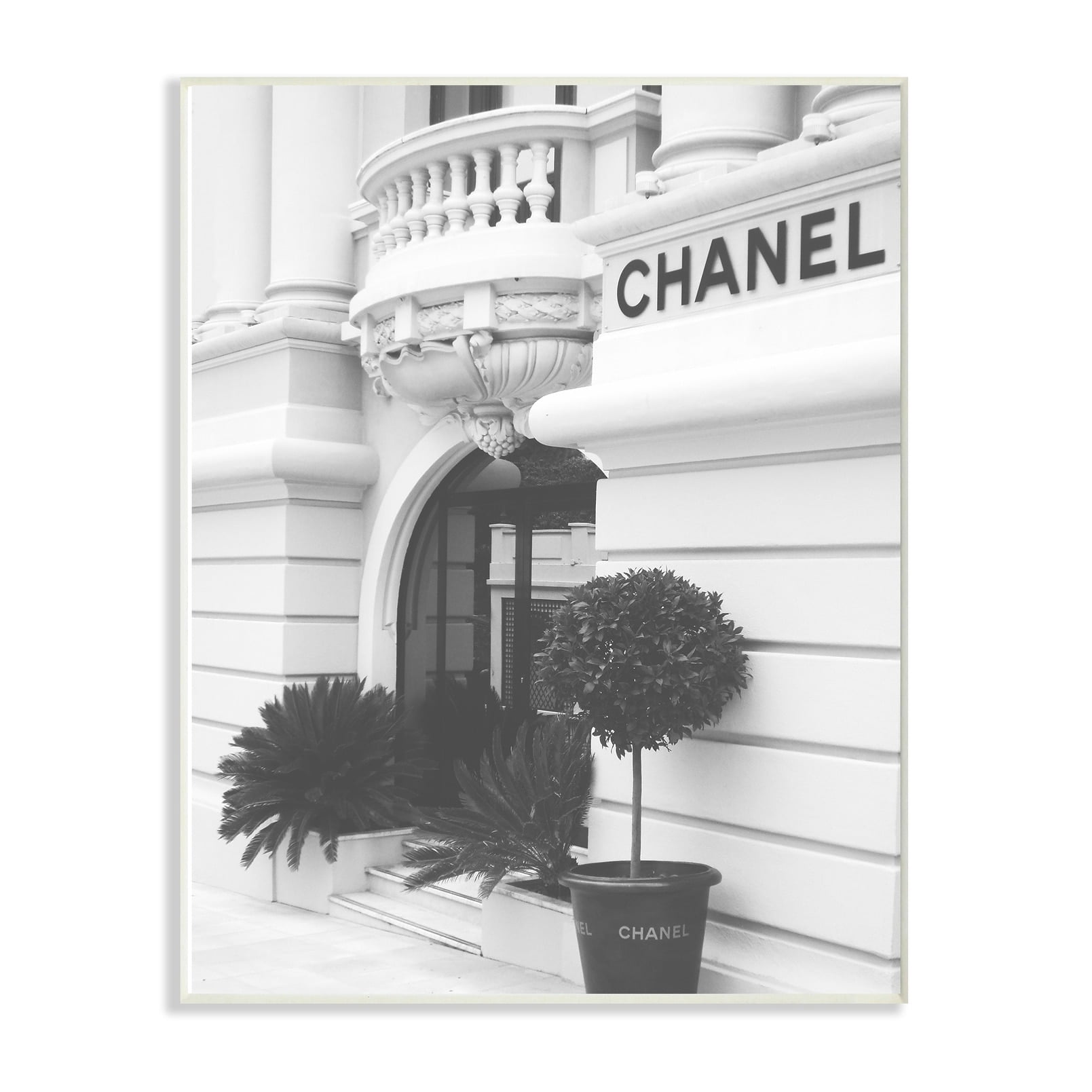 The Stupell Home Decor Black and White High Fashion Store Front Wall Plaque Art