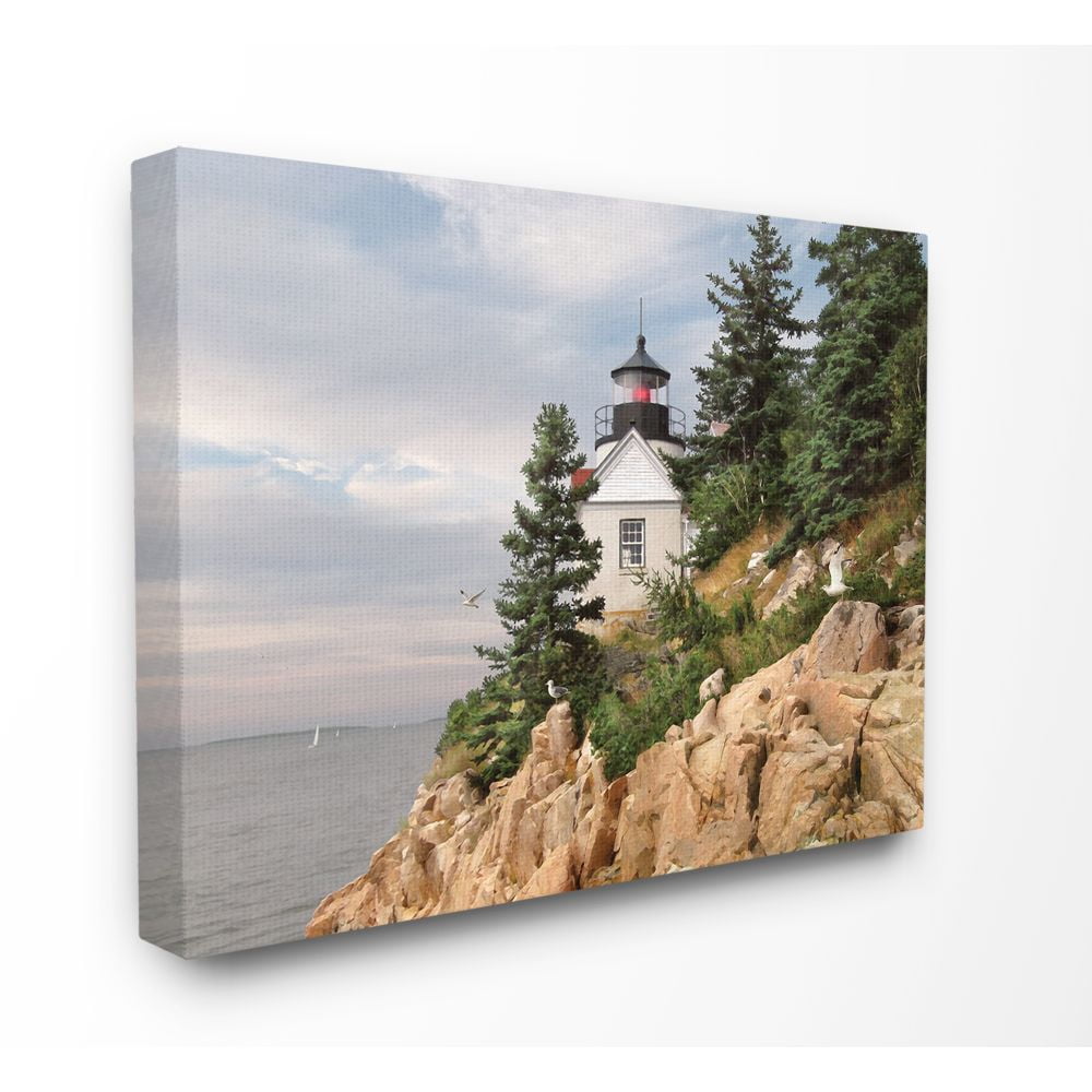 The Stupell Home Decor Collection Harbor Lighthouse Seaside Photograph with Fir Trees and Rocky Cliff Super Canvas Wall Art