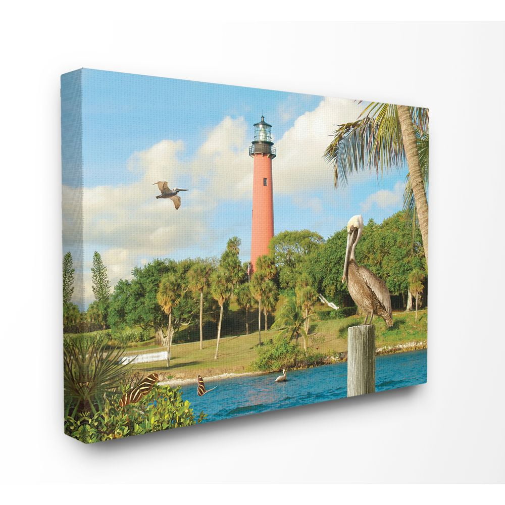 The Stupell Home Decor Collection Juptier Inlet Bright Red Lighthouse with Tropical Birds and Palm Trees Canvas Wall Art