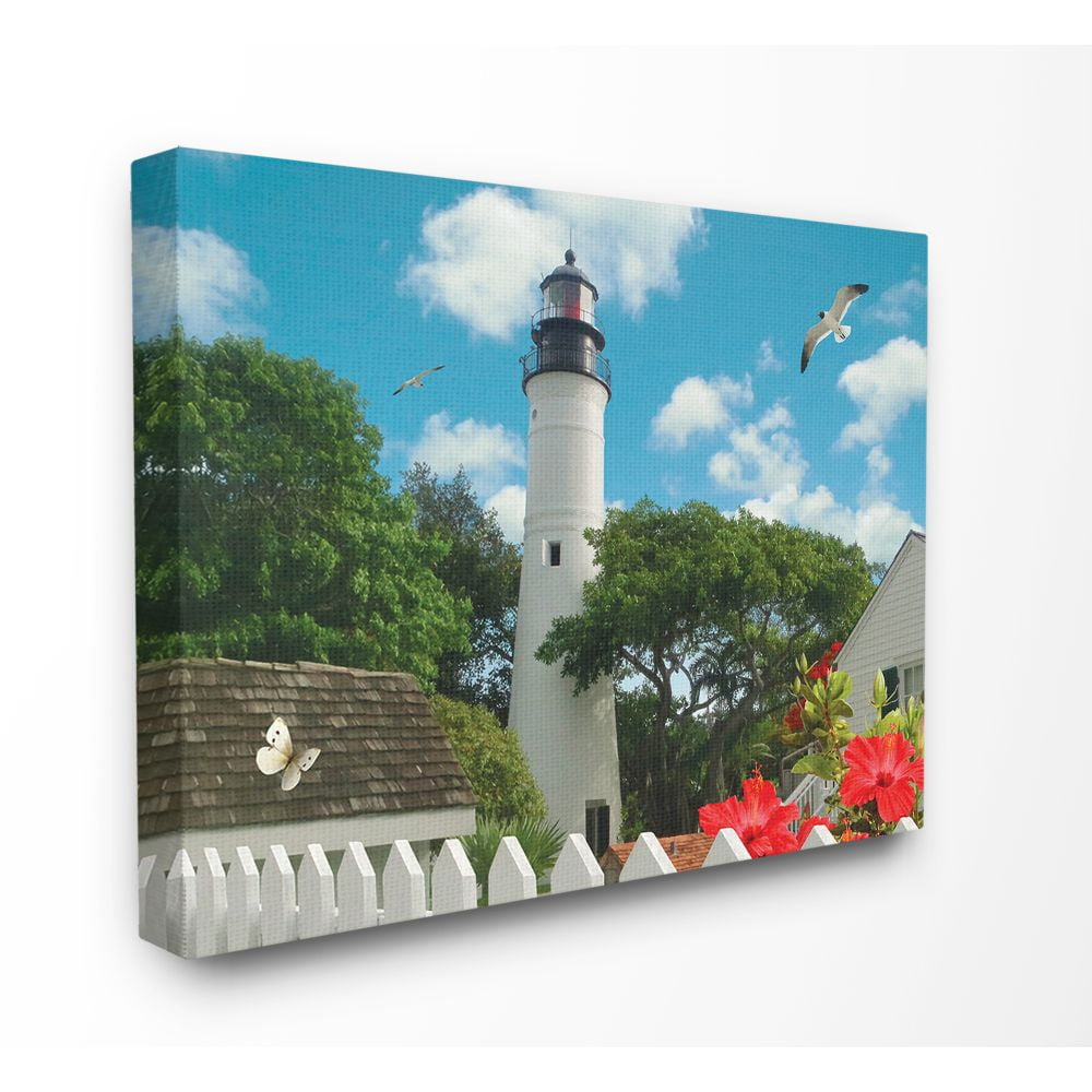 The Stupell Home Decor Collection Key West Light House with Picket Fence Butterfly and Seagull Canvas Wall Art