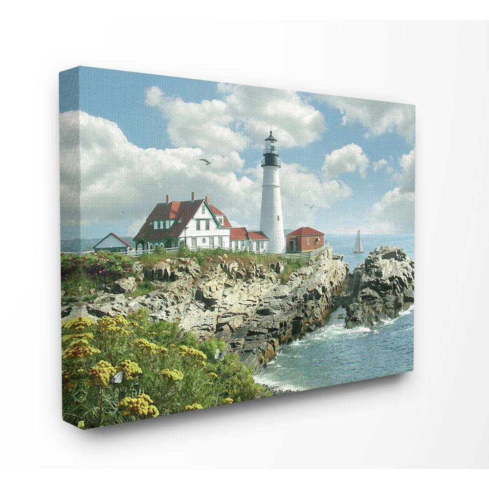 The Stupell Home Decor Collection Portland Head Lighthouse Scene Grassy Ocean Side Peninsula with Sail Boat Canvas Wall Art