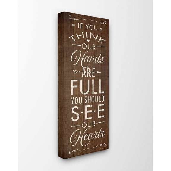 The Stupell Home Decor Hands Full Hearts Full Brown Planked Look Typography Canvas Wall Art, 10 x 24