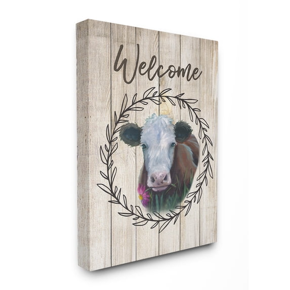 The Stupell Home Decor Welcome Sign Painted Cow with Flower and Wreath Canvas Wall Art