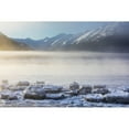 thumbnail image 1 of The Sun Shines Through Low Altitude Fog Cast In Warm Light Along Turnagain Arm And The Seward Highway Sea Ice Covering The Ocean In The, 1 of 3