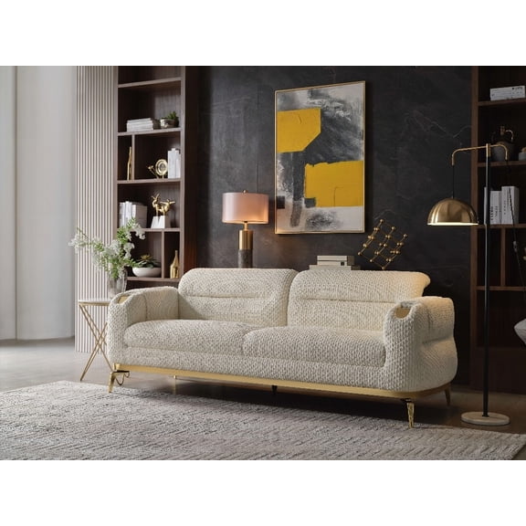 The Zoe Sofa in Cream, Made of Wood and Adorned with Gold Accents