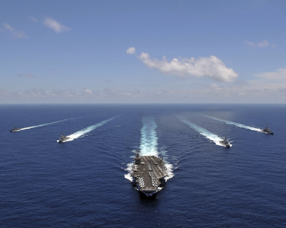 The aircraft carrier USS Abraham Lincoln leading a formation of ships from the Abraham Lincoln Strike Group Canvas Art - Stocktrek Images (31 x 25)
