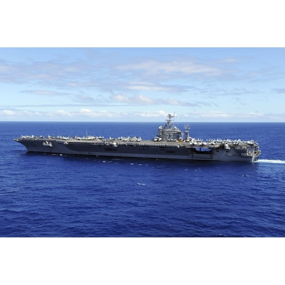 The aircraft carrier USS Abraham Lincoln transits across the Pacific Ocean Poster Print