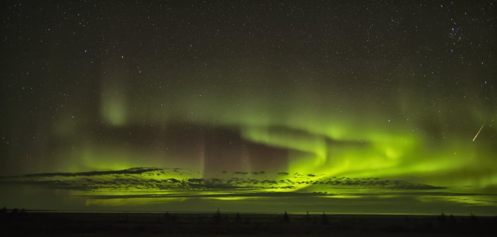 The aurora borealis and a shooting star above Hudson Bay Manitoba Canada Canvas Art - Robert Postma Design Pics (22 x 10)