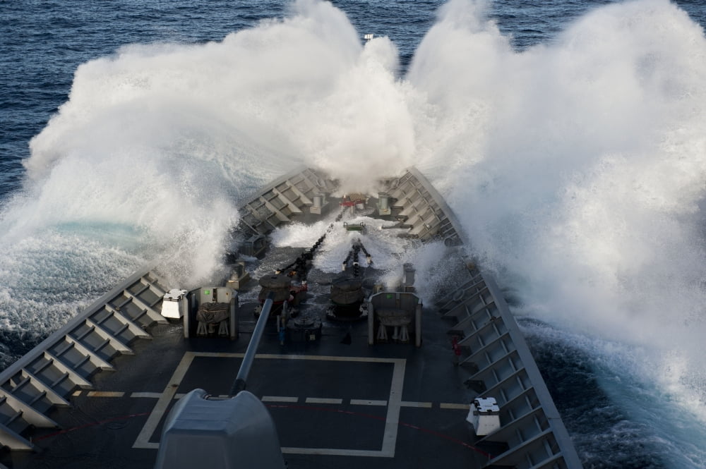 The bow of USS Cowpens plows through a wave in rough seas Canvas Art - Stocktrek Images (34 x 23)
