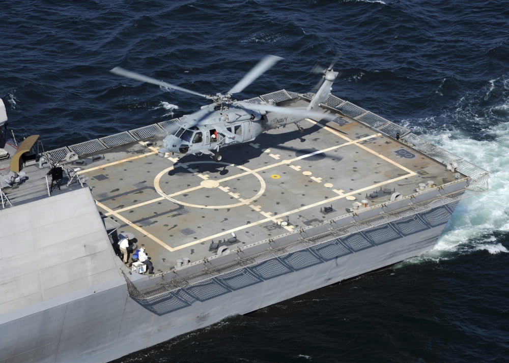 The littoral combat ship USS Freedom with an MH-60S Sea Hawk helicopter Canvas Art - Stocktrek Images (34 x 24)