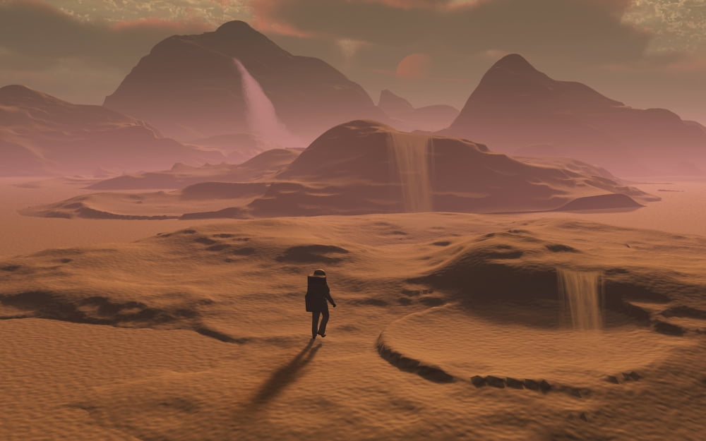 The lone figure of an explorer watching the sandfalls of a barren planet Canvas Art - Mark StevensonStocktrek Images (36 x 23)