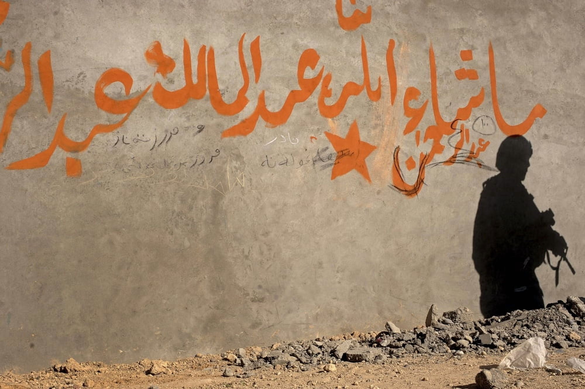 The shadow of a US Army soldier on the wall of an Afghan building Canvas Art - Stocktrek Images (35 x 23)