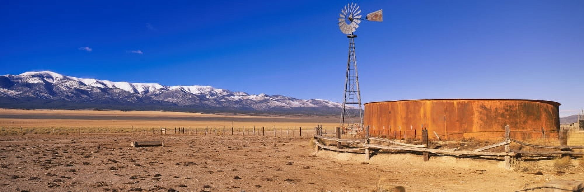 This is an old wooden windmill in an open field in the old west Canvas Art - Panoramic Images (36 x 12)