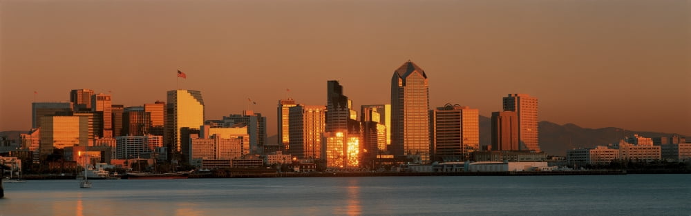 This is the San Diego skyline with the bay in front at sunset The reflected light on the buildings is golden Canvas Art - Panoramic Images (36 x 12)