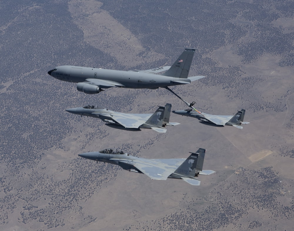 Three F-15 Eagles conduct aerial refueling with a KC-135 Stratotanker Canvas Art - HIGH-G ProductionsStocktrek Images (17 x 13)