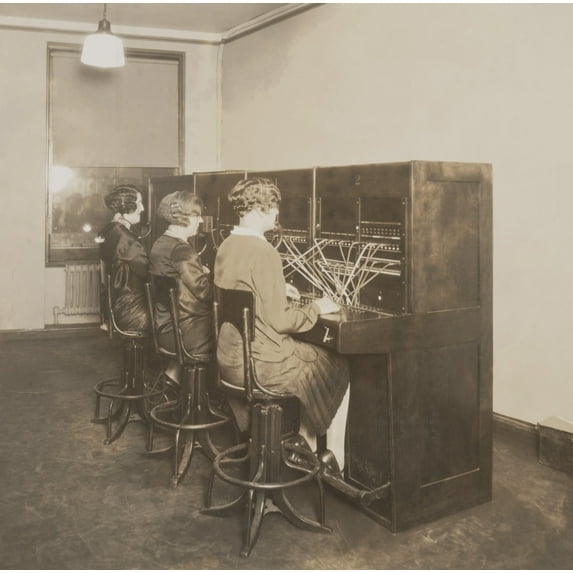 Three Female Telephone Switchboard Operators In The Quotation Room Of New York Stock Exchange. Until The 1960S When