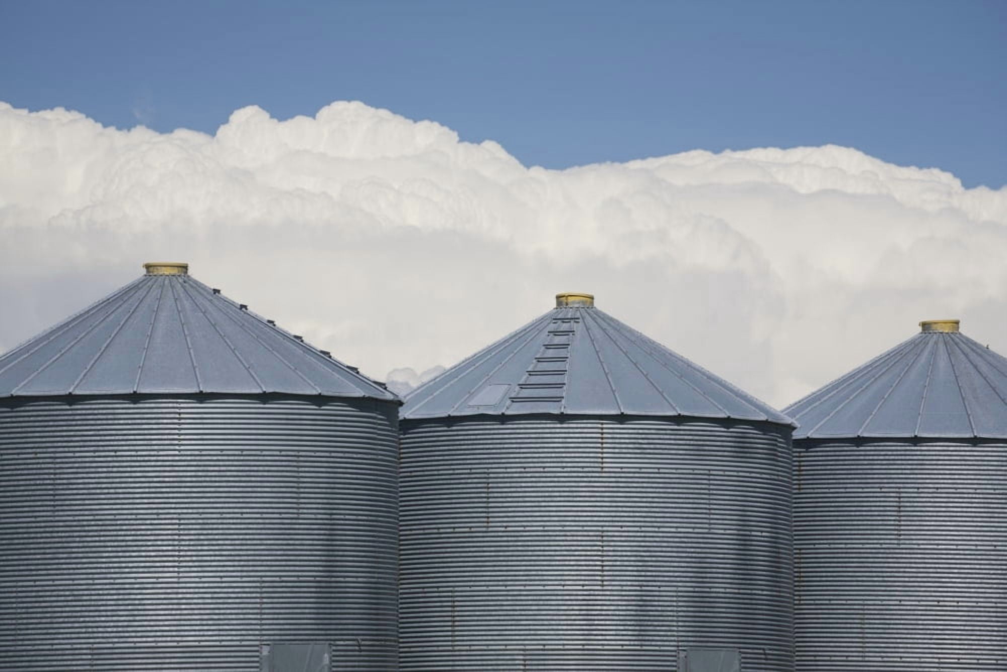 Three Grain Bins With Dramatic Thunder Storm Clouds In The Background And Blue Sky Alberta Canada Canvas Art - Michael Interisano Design Pics (38 x 24)