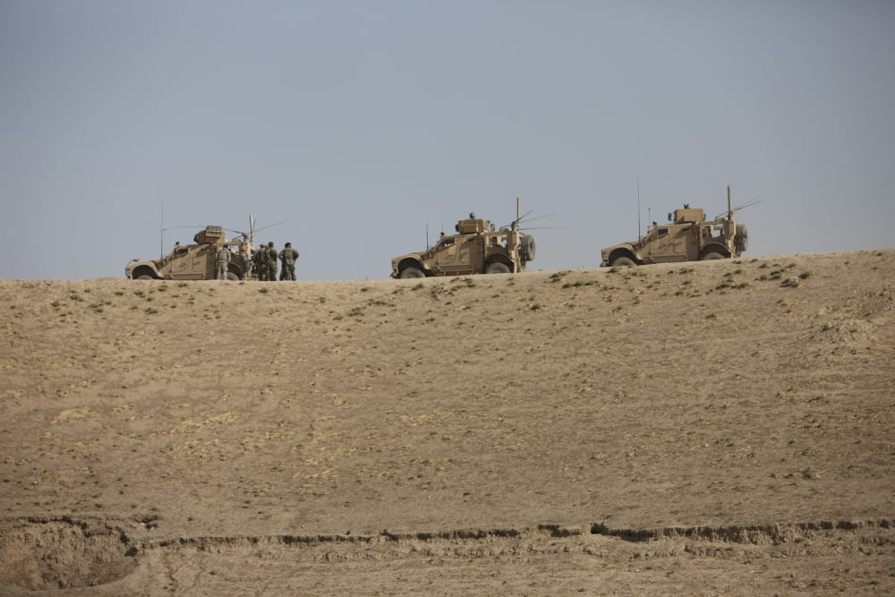 Three M-ATVs guard the top of the wadi near Kunduz Afghanistan Canvas Art - Terry MooreStocktrek Images (18 x 12)
