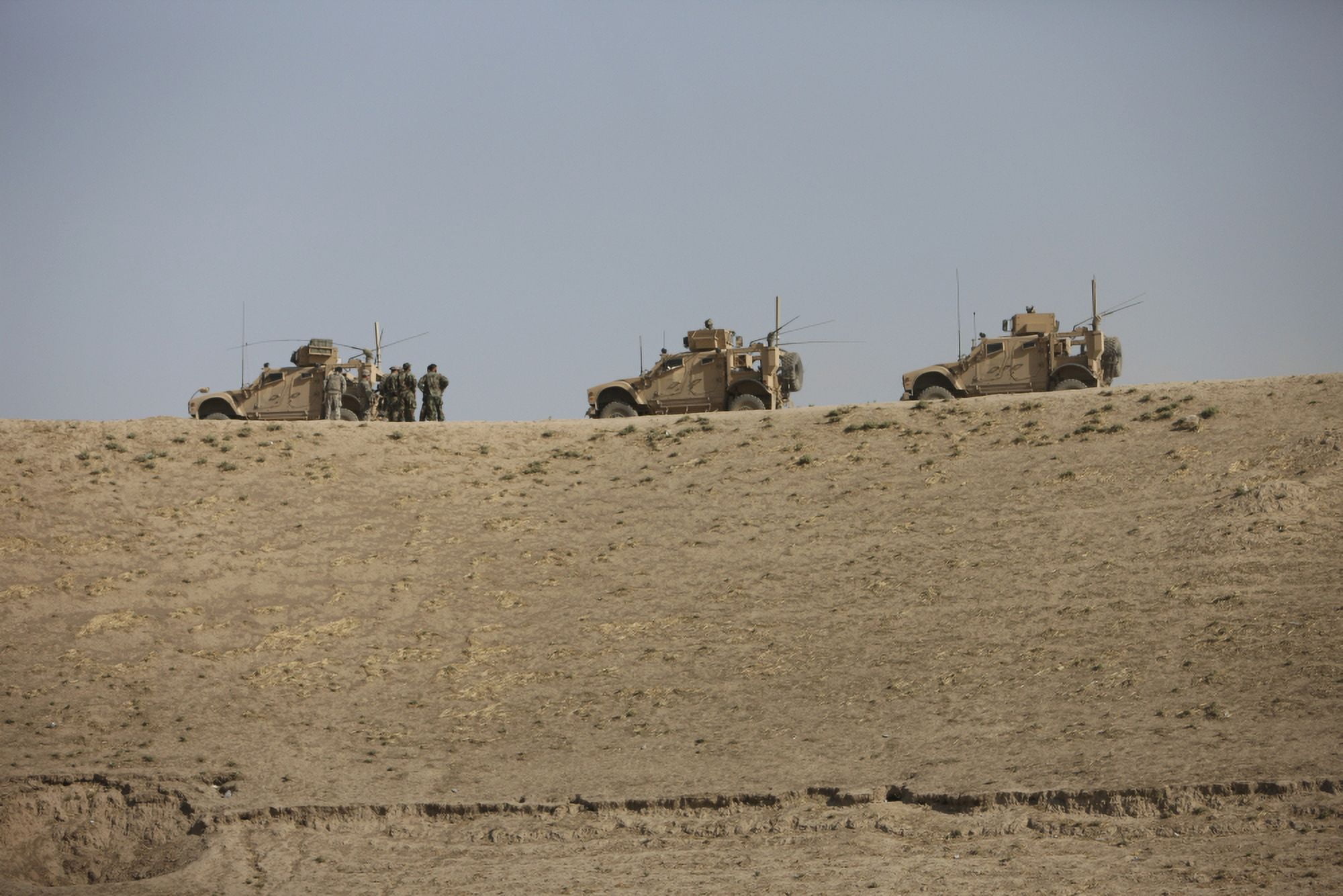 Three M-ATVs guard the top of the wadi near Kunduz Afghanistan Canvas Art - Terry MooreStocktrek Images (35 x 24)