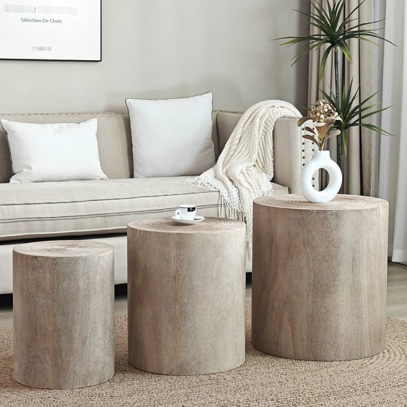 Three Round Natural Wood Coffee Tables with Visible Tree Rings for Lounge Use