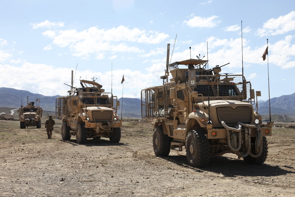 Three US Army Mine Resistant Ambush Protected vehicles Canvas Art - Stocktrek Images (35 x 23)