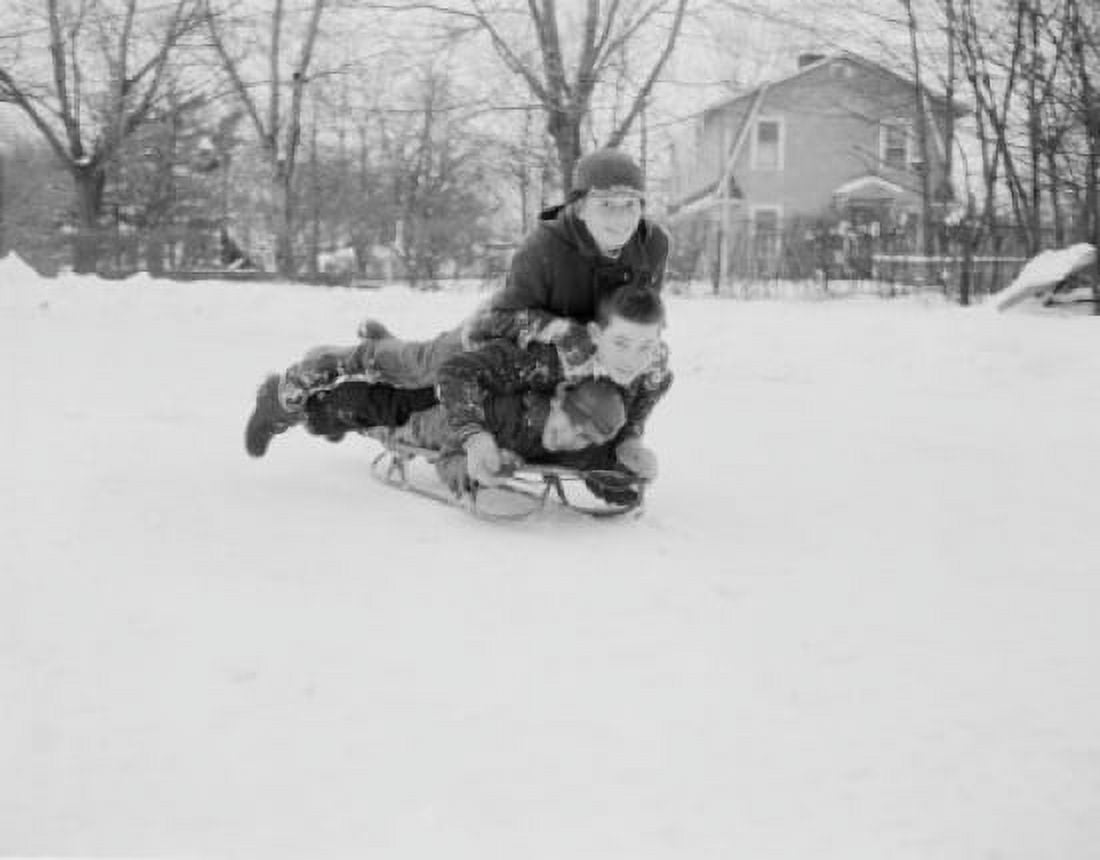 Three boys sledding down on slope Canvas Art -  (18 x 24)