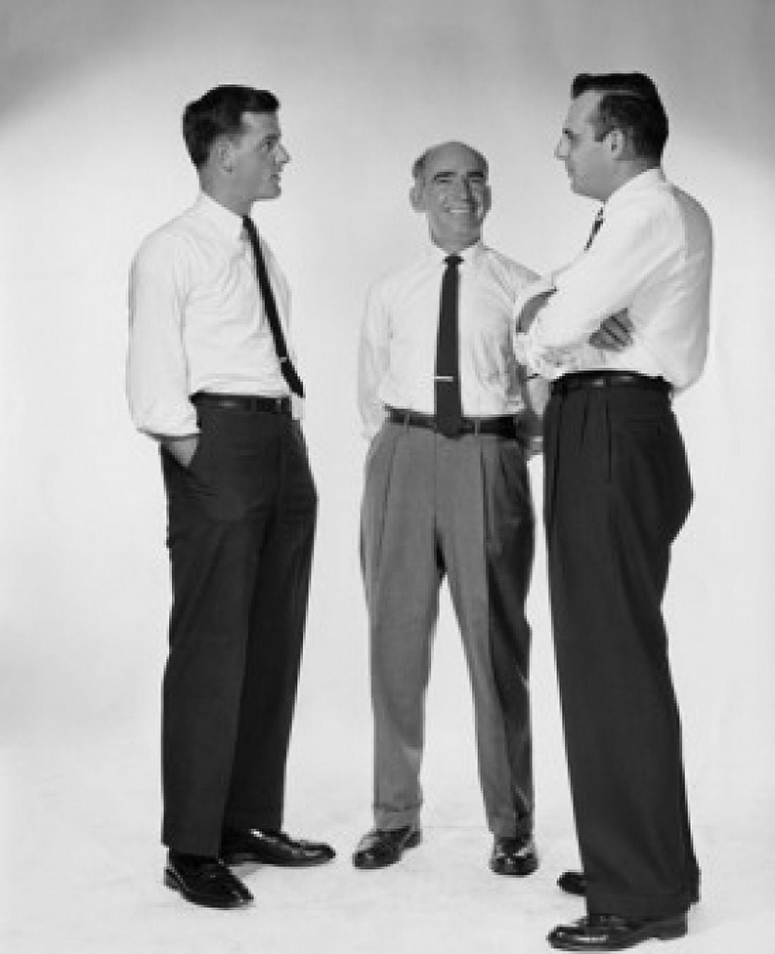 Three businessmen talking Canvas Art - (18 x 24)
