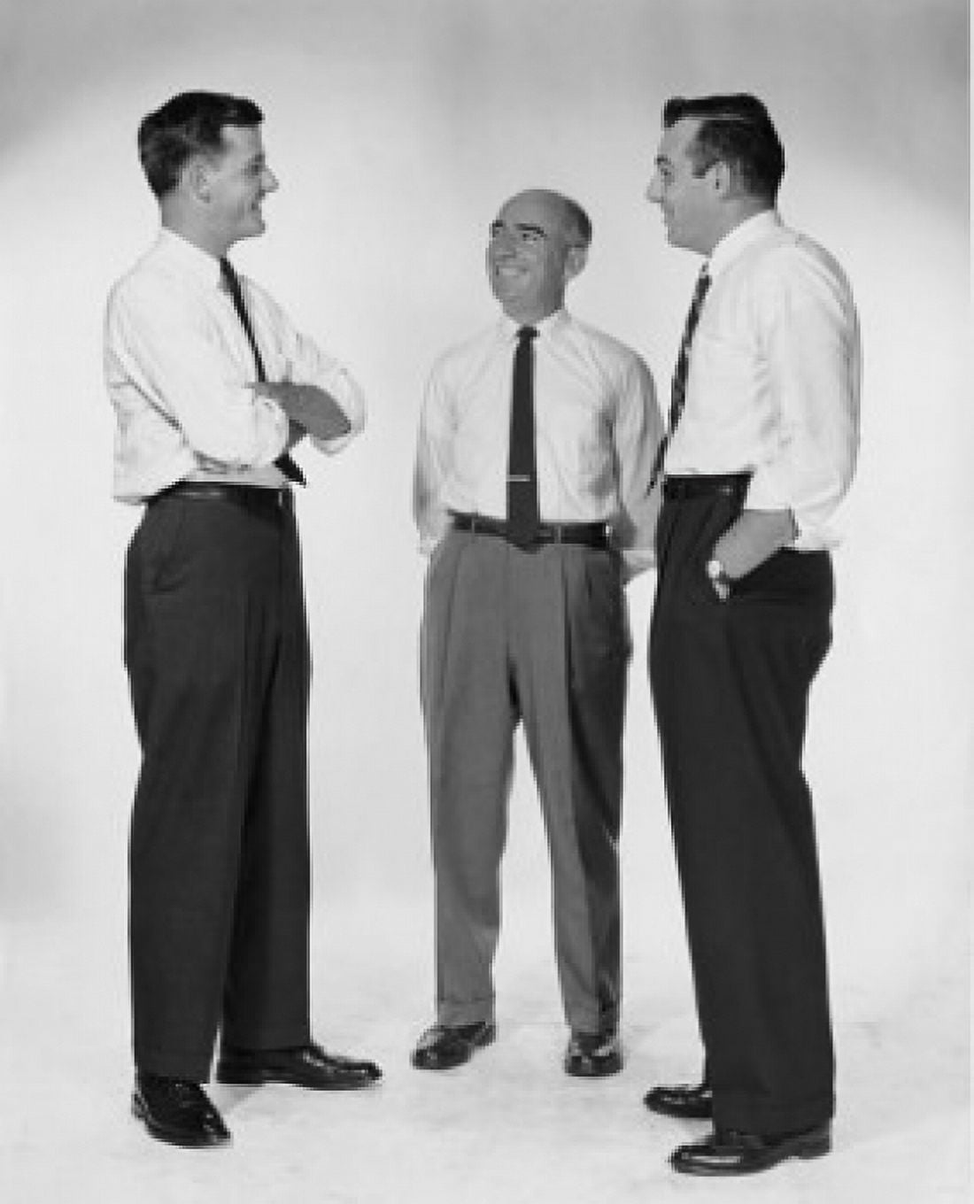 Three businessmen talking Canvas Art - (18 x 24)