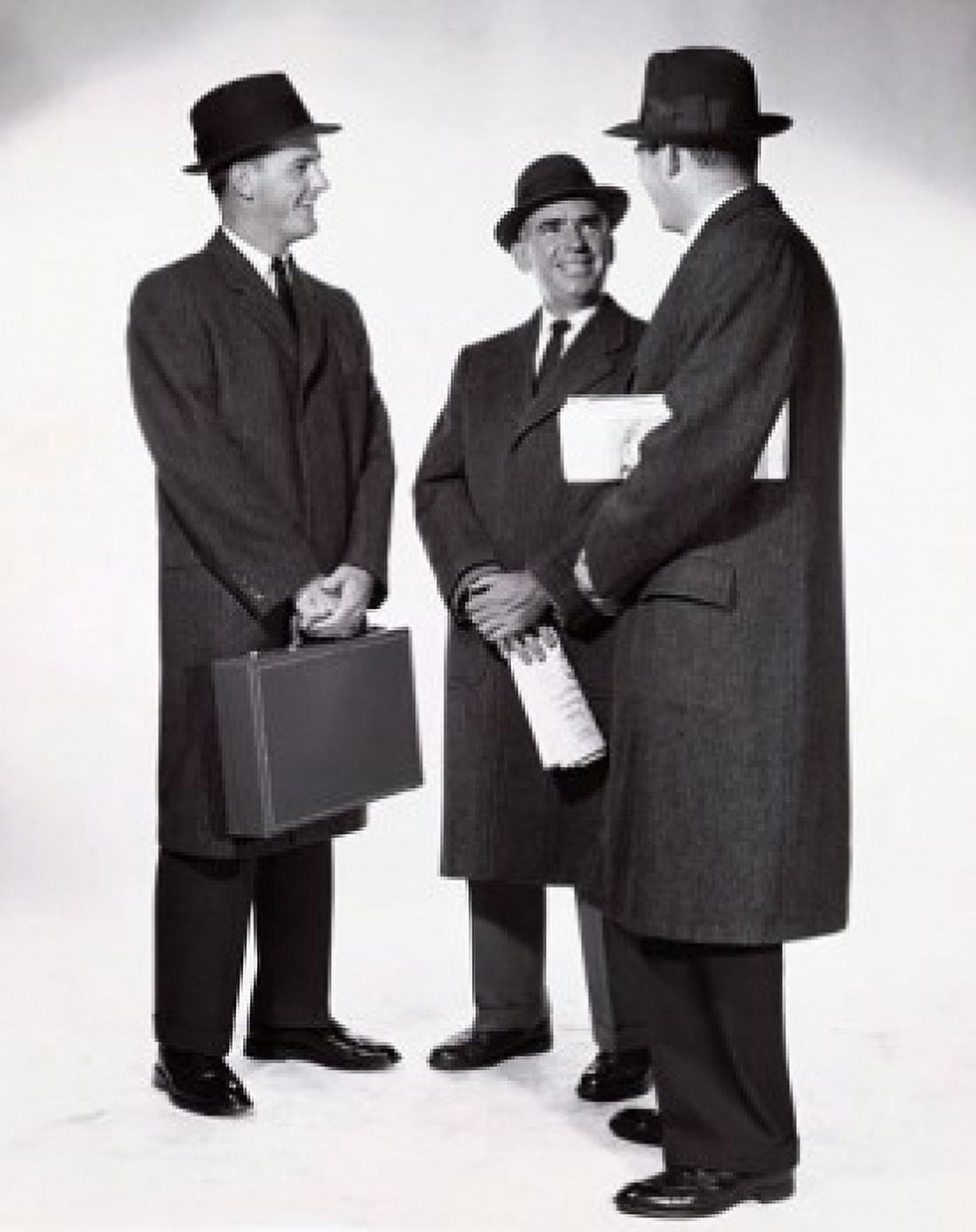 Three businessmen talking Canvas Art - (18 x 24)