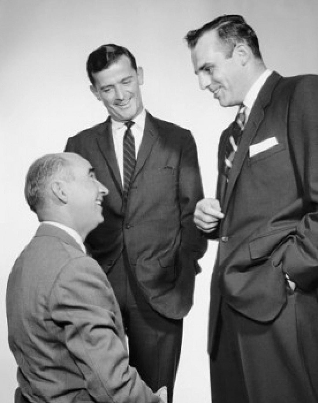 Three businessmen talking Canvas Art - (24 x 36)