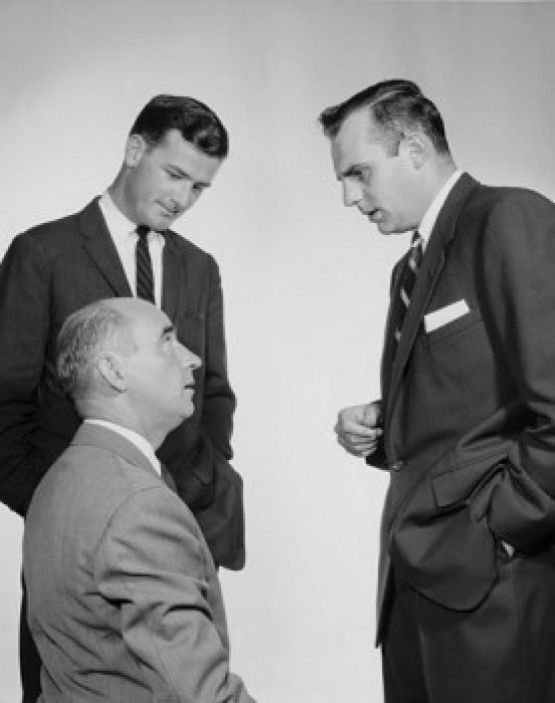 Three businessmen talking Canvas Art - (24 x 36)