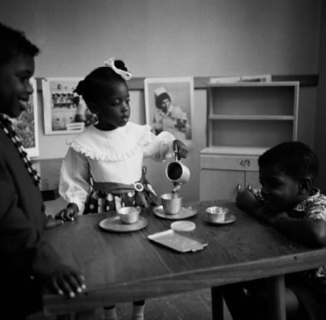 Three children playing with tea set Canvas Art - (24 x 36)