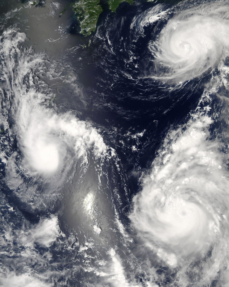 Three different typhoons spinning over the western Pacific Ocean Canvas Art - Stocktrek Images (26 x 32)