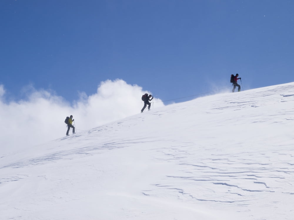 Three ski tourists walking to the summit Switzerland Canvas Art - Penny Kendall Design Pics (17 x 13)