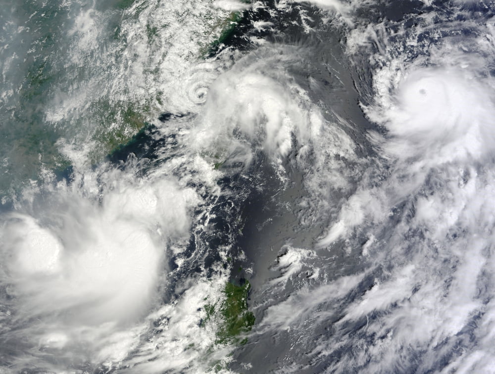 Three strong storms churn in the Pacific Ocean Basin off the Asian coast Canvas Art - Stocktrek Images (33 x 25)