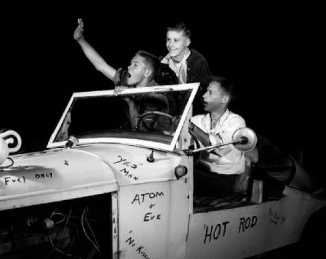 Three teenage boys in convertible car at night Canvas Art - (24 x 36)