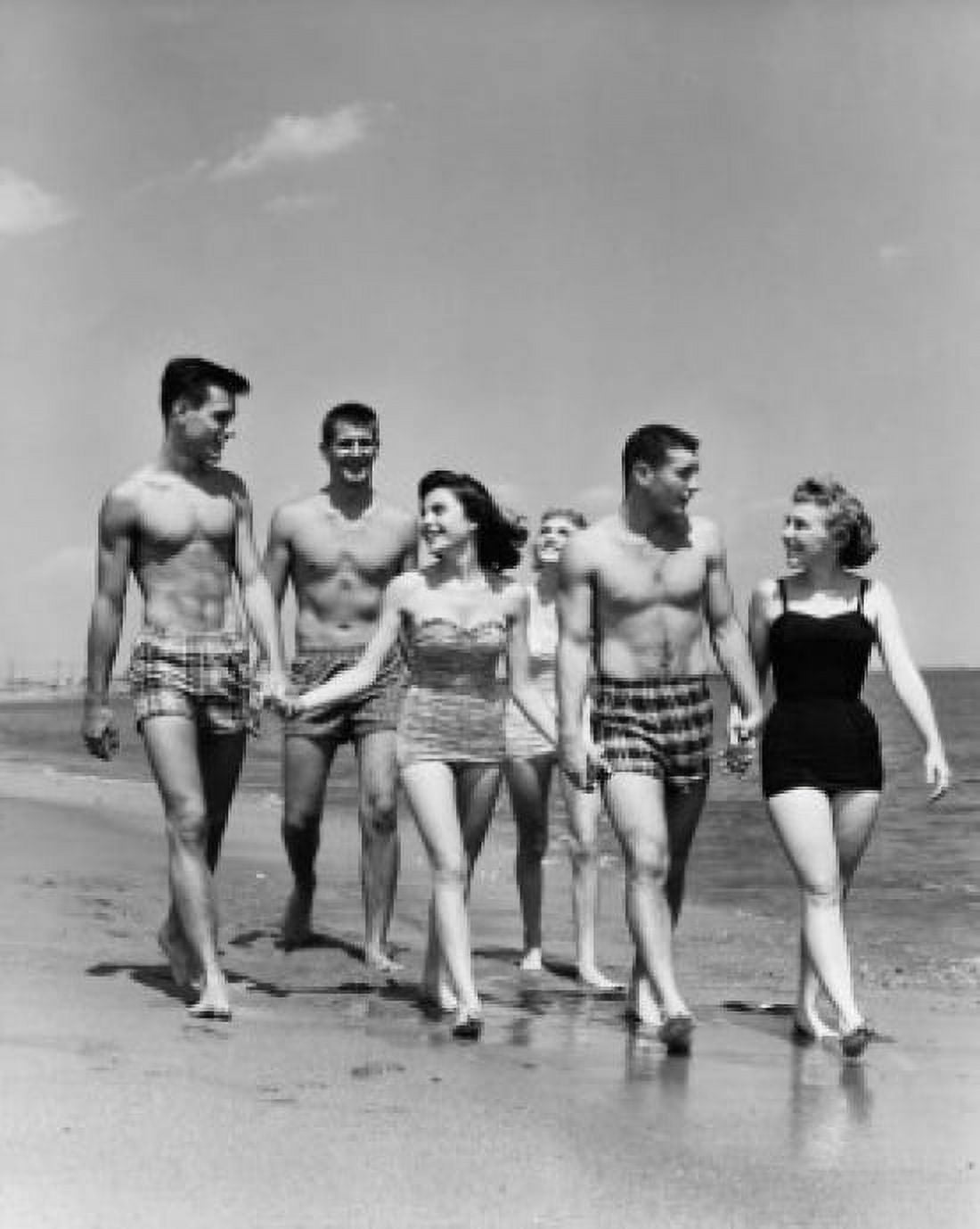Three teenage couples walking on beach Canvas Art - (18 x 24)