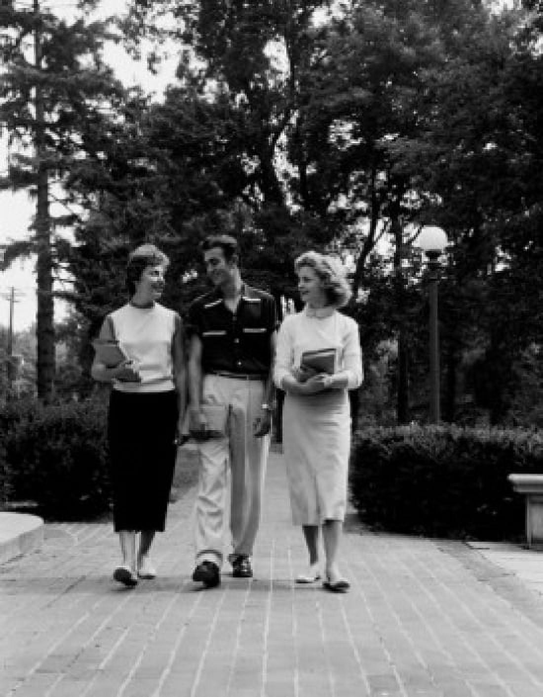 Three young students walking and talking Canvas Art - (18 x 24)