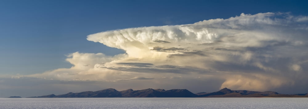 Thunderhead clouds over the salt flats of Salar de Uyuni Potosi Department Bolivia Canvas Art - Panoramic Images (27 x 9)