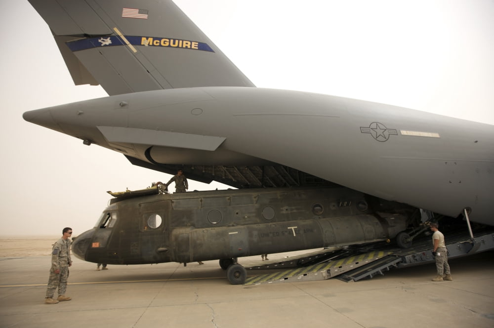 Tikrit Iraq - A CH-47 Chinook being loaded onto a C-17 Globemaster III Canvas Art - Terry MooreStocktrek Images (18 x 12)